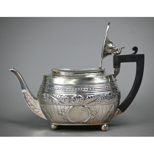 107 - A Victorian silver tea pot in the Regency taste, with dolphin finial and composite handle, on bun fe... 