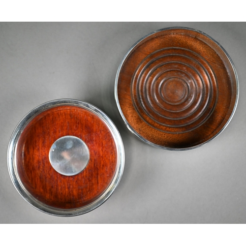 110 - Two silver wine bottle coasters with wooden bases,  London 1997/2003, 12.5/11.5cm (2)