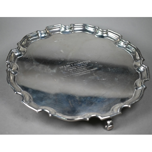 113 - A silver salver with moulded rim, on three scroll feet, William Greenwood & Sons, Birmingham 194... 