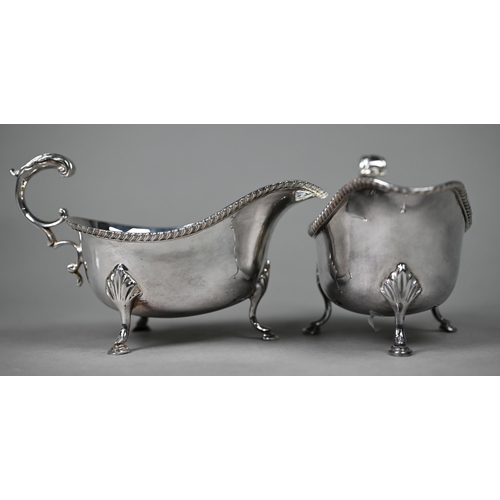 119 - A pair of silver sauce boats with gadrooned rims and scroll handles, on hoof feet, Roberts & Bel... 