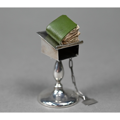 122 - A novelty silver miniature lectern, containing a miniature New Testament (book a/f), Henry Williamso... 