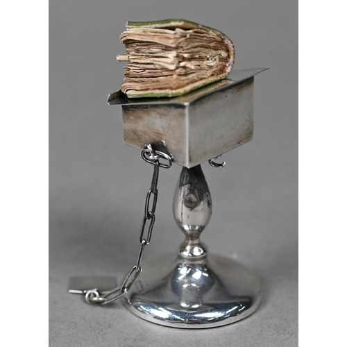 122 - A novelty silver miniature lectern, containing a miniature New Testament (book a/f), Henry Williamso... 