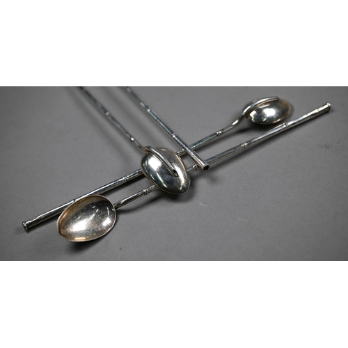 129 - A Victorian pair of silver fiddle pattern sugar tongs, London 1894, various small silver spoons and ... 