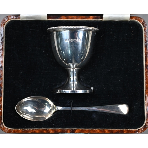 131 - Two cased silver egg cups with spoons - one also with napkin ring - to/w a cased miniature condiment... 