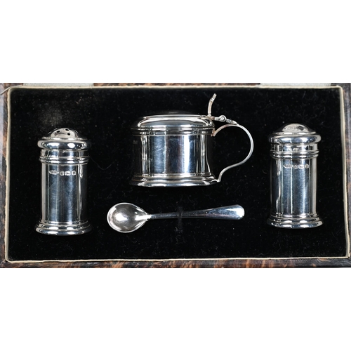 131 - Two cased silver egg cups with spoons - one also with napkin ring - to/w a cased miniature condiment... 