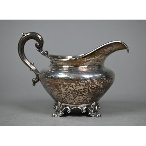 142 - An early Victorian silver milk jug with moulded rim and scroll handle and feet, Edward, Edward junio... 