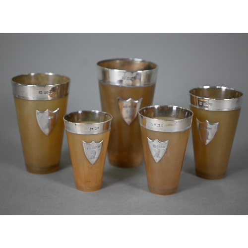 177 - An Edwardian graduated set of five silver-mounted horn beakers, Frederick C. Asman & Co, Sheffie... 