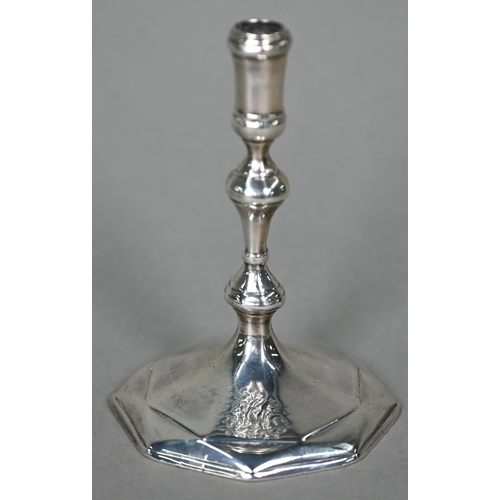 181 - A Queen Anne Britannia standard silver taperstick with baluster stem and octagonal foot, Robert Kemp... 