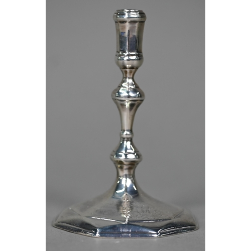 181 - A Queen Anne Britannia standard silver taperstick with baluster stem and octagonal foot, Robert Kemp... 