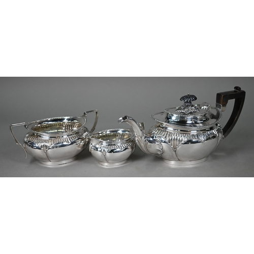 199 - A late Victorian silver three-piece tea service with gadrooned rims and lobed bodies with fluted det... 