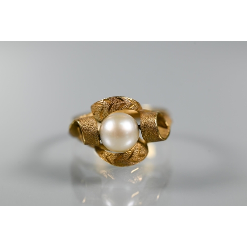 200 - Two pearl set rings, one unmarked yellow metal in scroll setting, size N (shank distorted), the othe... 