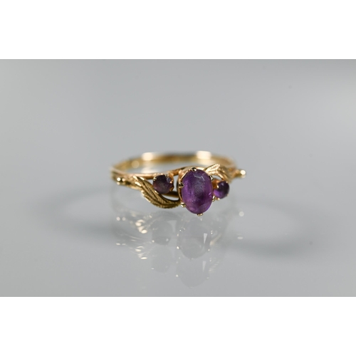 203 - Three 9ct yellow gold rings - a three-stone amethyst in scroll setting, garnet cluster and two stone... 