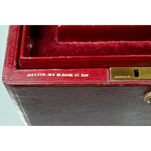 205 - A dark red jewel case with dark red velvet-lined fitted interior and two lift out trays, Bramah lock... 