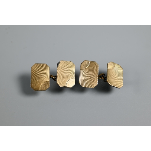 212 - A pair of 9ct yellow gold rectangular cufflinks with canted corners, chain-linked, with engraved I96... 