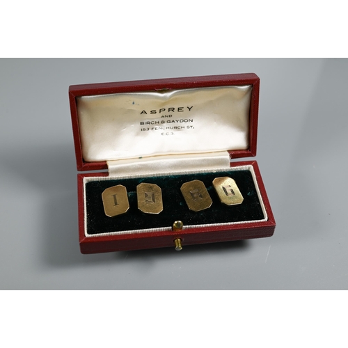 212 - A pair of 9ct yellow gold rectangular cufflinks with canted corners, chain-linked, with engraved I96... 