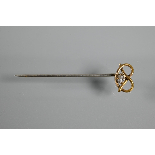 213 - A 9ct rose gold safety-pin brooch, approx 2.5g in fitted case to/w knot style stick pin set white pa... 