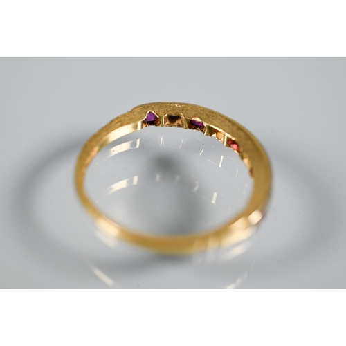 214 - An 18ct yellow gold half eternity ring set rubies and diamonds, size M 1/2, shank worn