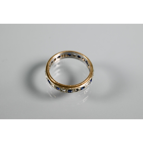 218 - A 9ct yellow and white gold eternity ring set alternate blue sapphires and white stones, size O, app... 