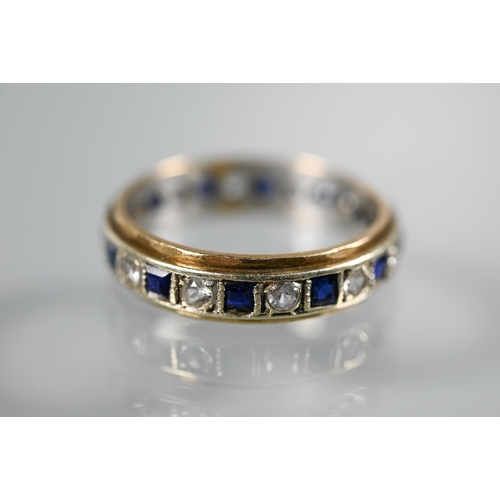 218 - A 9ct yellow and white gold eternity ring set alternate blue sapphires and white stones, size O, app... 