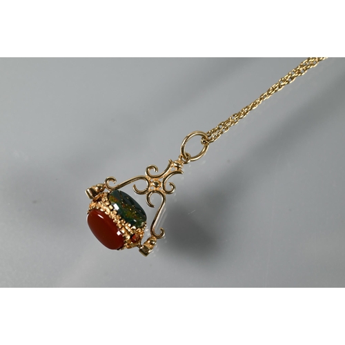 220 - A swivel fob set with cornelian, bloodstone and carved onyx, on 9ct yellow gold chain, 23 cm long (c... 