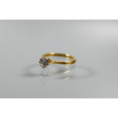 226 - A single stone diamond ring, the brilliant cut diamond in coronet setting with scroll shoulders, 18c... 