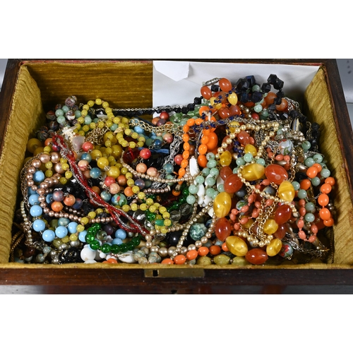 262 - A mahogany box with a collection of vintage bead necklaces including cornelian, agate, glass etc