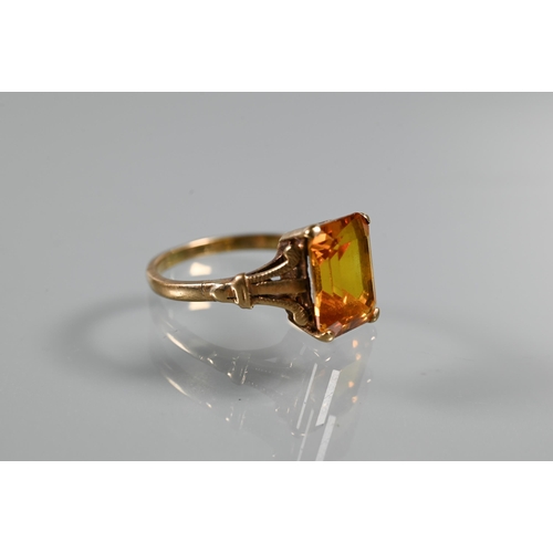 268 - Three rings - a rectangular step cut citrine in 9ct yellow gold shank with decorative plume shoulder... 