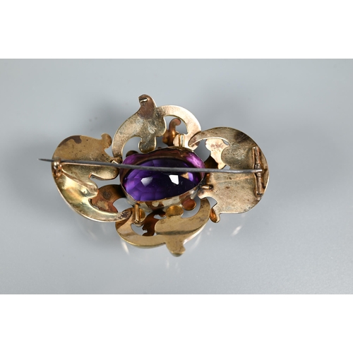 271 - A large Victorian brooch with large purple stone in ornate gilt metal scroll mount, 7 x 6 cm to/w a ... 