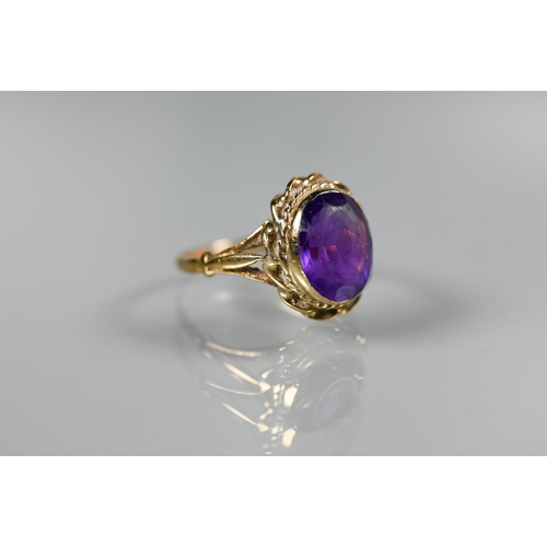 277 - A 9ct yellow gold ring set oval amethyst, size M to/w a 9ct yellow gold half eternity ring set sapph... 