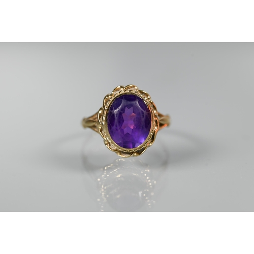 277 - A 9ct yellow gold ring set oval amethyst, size M to/w a 9ct yellow gold half eternity ring set sapph... 