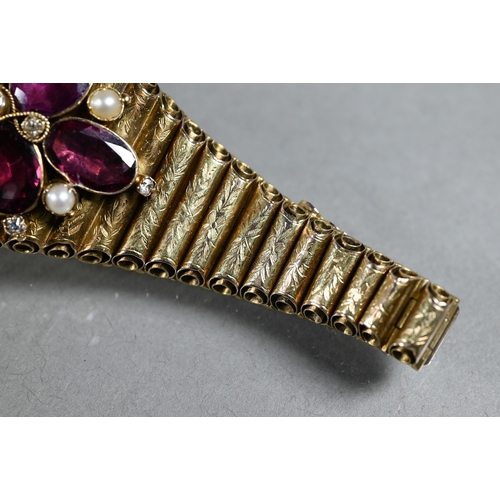 280A - A Victorian garnet, diamond and pearl yellow gold elliptical bracelet formed of foliate engraved tub... 