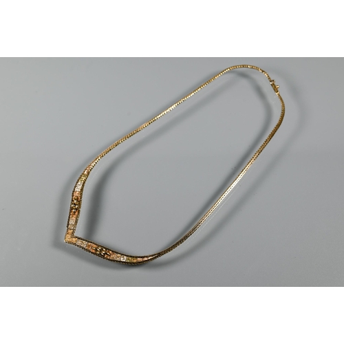 285 - A 9ct tri-coloured gold necklace of feather-link chain forming wishbone to centre of rectangular pla... 