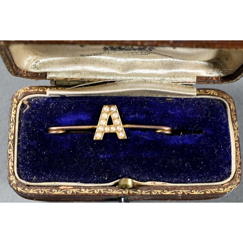 285A - A collection of Victorian jewellery items including 18ct and black enamel mourning ring, letter 'A' ... 