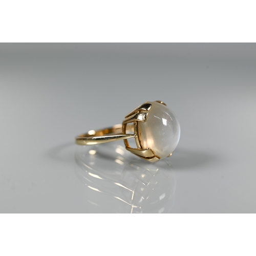 293 - A 9ct yellow gold ring set with single oval moonstone in claw setting, size N, 1.5 x 1.2 cm diam to/... 