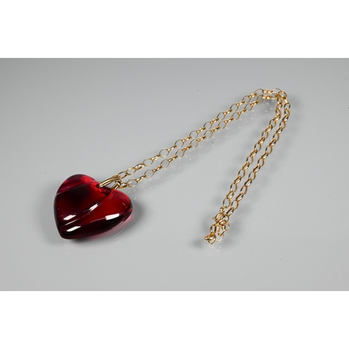 294 - A Baccarat red glass heart-shaped pendant, etched Baccarat, 3.5 cm long, on 9ct yellow gold belcher ... 