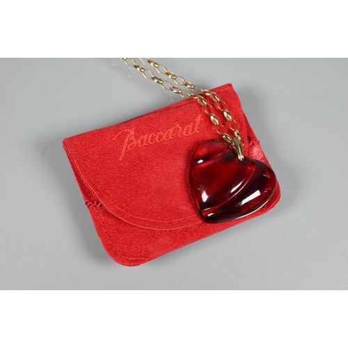 294 - A Baccarat red glass heart-shaped pendant, etched Baccarat, 3.5 cm long, on 9ct yellow gold belcher ... 