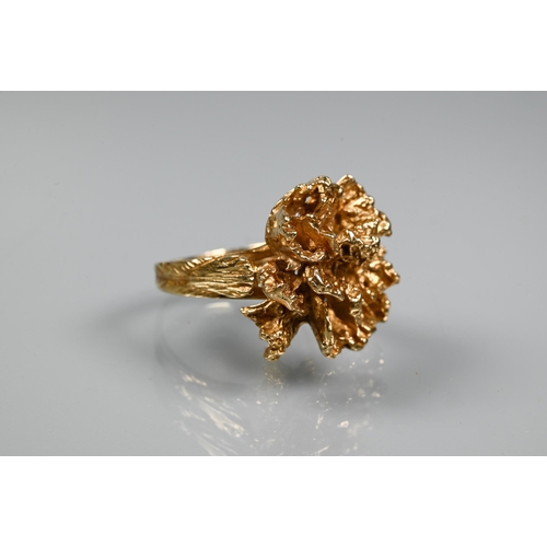 295 - A 1970s 9ct yellow gold ring in the form of a sculptural open flower, with textured shoulders, maker... 