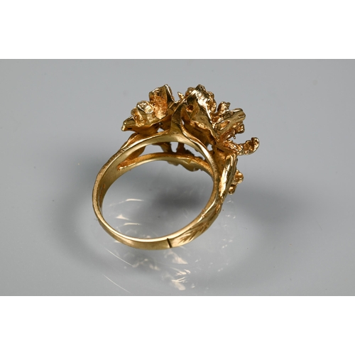 295 - A 1970s 9ct yellow gold ring in the form of a sculptural open flower, with textured shoulders, maker... 