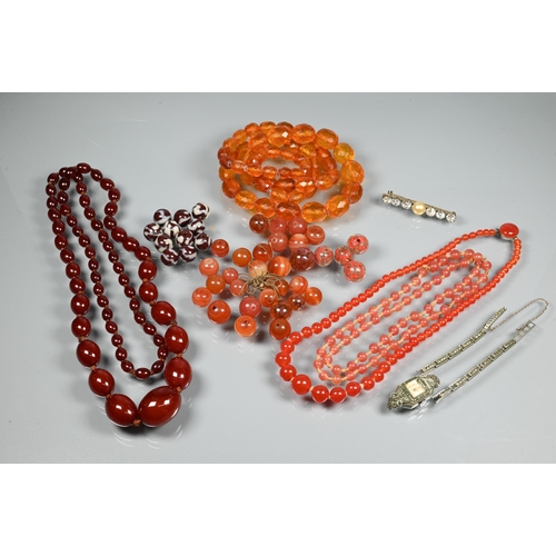 297 - A facetted orange amber graduated necklace, 54.1g; a cherry red amber graduated necklace, 50.4g; a r... 