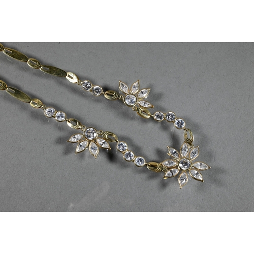 300A - A necklace and earring suite  formed of flat links with flower style clusters set possibly white spi... 