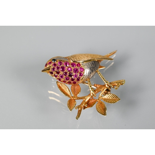 301 - A gold and ruby brooch in the form of a robin perched on a branch, with vari-textured body and ruby ... 