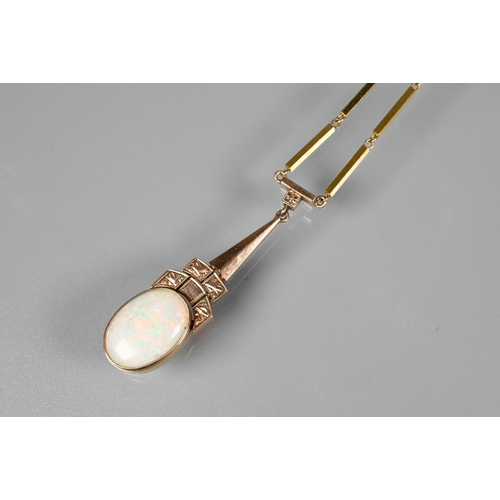 309 - An oval white opal set ring, 9ct rose gold, size L to/w an Art Deco style white opal set pendant nec... 