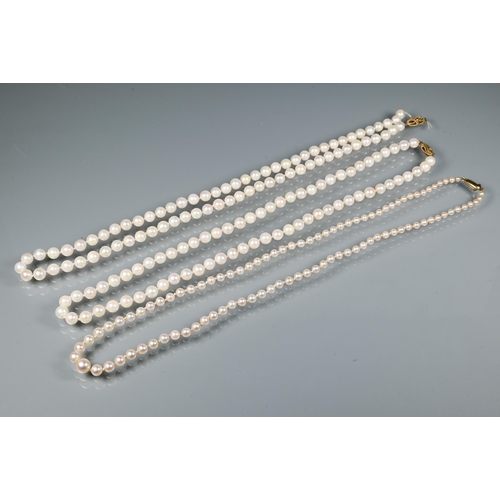 311 - Two uniform cultured pearl necklaces knotted throughout onto 9ct yellow gold clasps, one as found, t... 