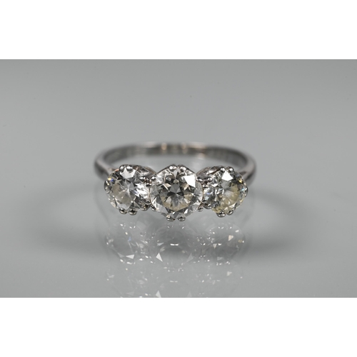 315 - A three-stone diamond ring, the three claw set diamonds set in 18ct white gold, diamond weight appro... 