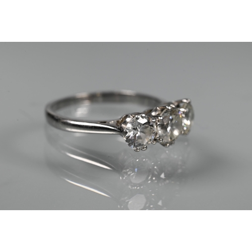 315 - A three-stone diamond ring, the three claw set diamonds set in 18ct white gold, diamond weight appro... 