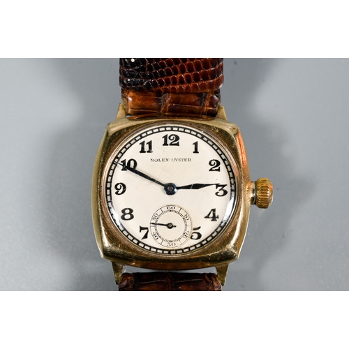 447 - A WWII period gents Rolex Oyster wristwatch, yellow metal 27 mm cushion case, the dial with Arabic n... 