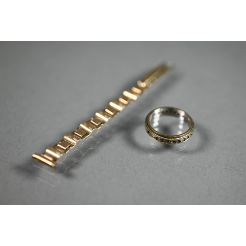 464 - A fragment of 9ct gold watch-strap, 3.4g, to/w a 9ct yellow and white gold eternity ring set with ge... 