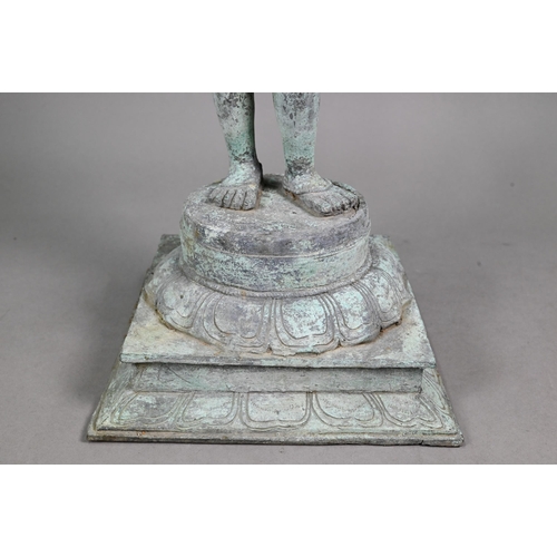 565 - A large Indian bronze figure of the Hindu deity Shiva standing on a stepped lotus base in the Chola ... 