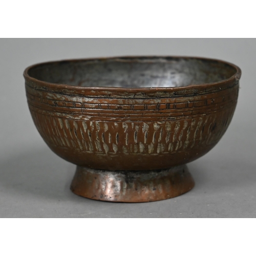 568 - A large Middle-Eastern engraved and embossed copper charger, 52 cm diameter, four various 19th centu... 