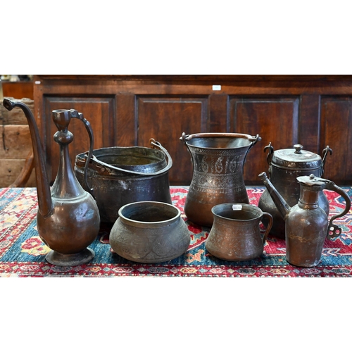 569 - A collection of antique Persian Qajar Islamic tinned copper metal ware including a large slender pit... 